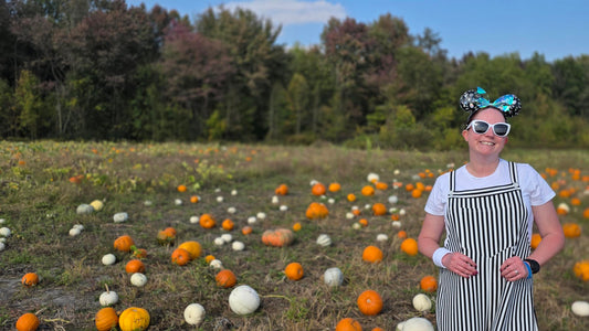Kelly bounding as Jack Skellington in a pumpkin patch