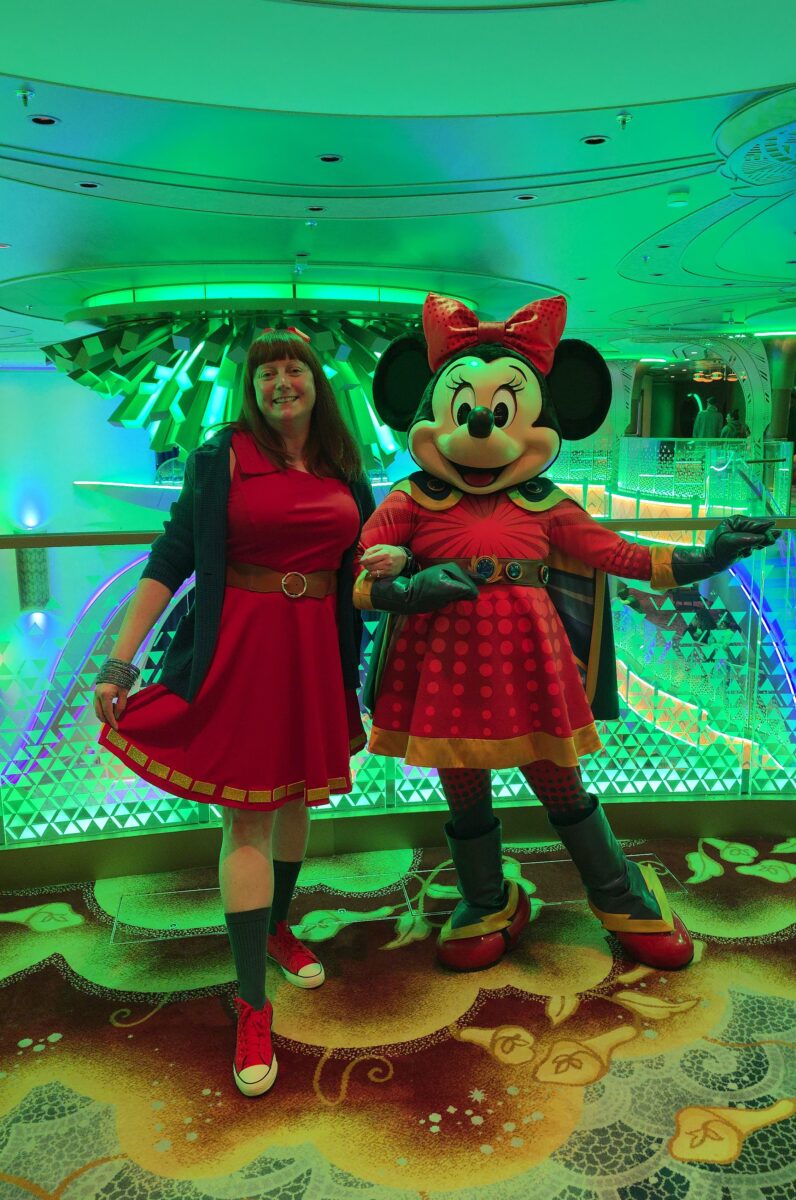 Kelly in her Superhero Minnie bound with Superhero Minnie on the Disney Destiny