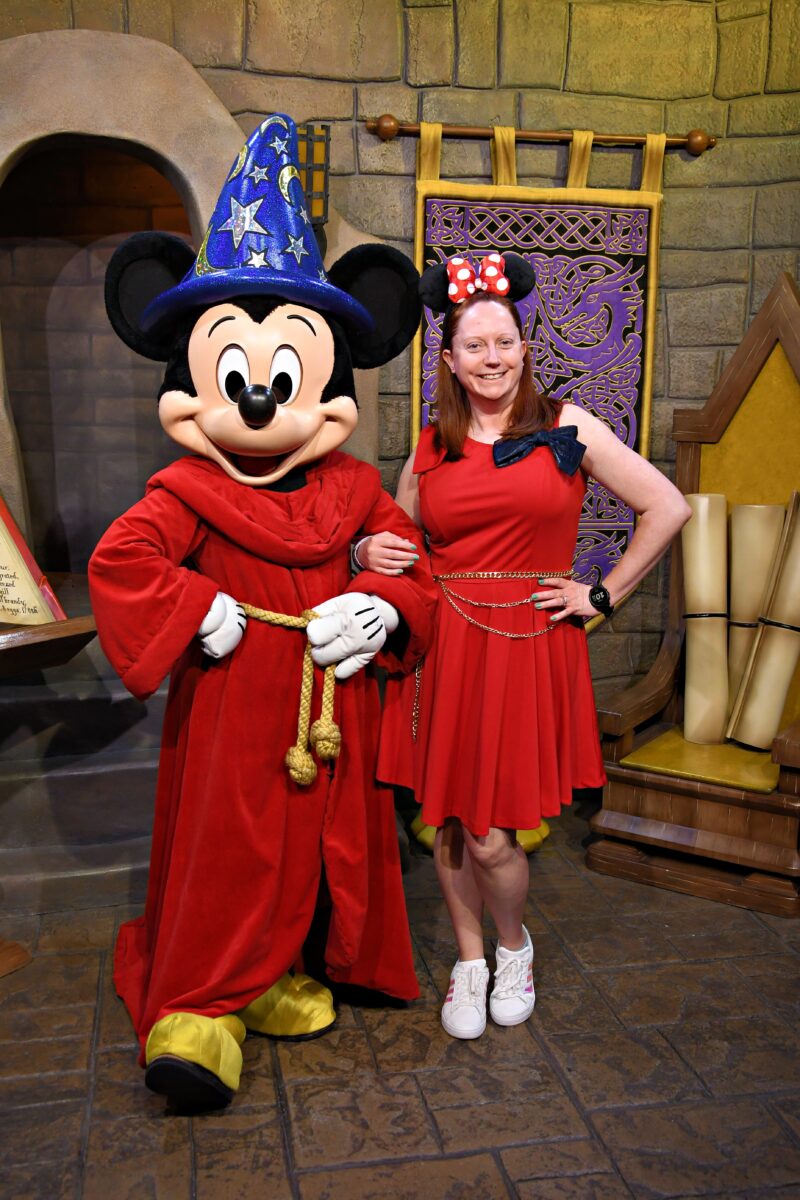 Kelly bounding as Sorcerer Mickey with Sorcerer Mickey at Disney’s Hollywood Studios