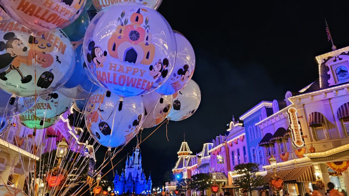 Halloween balloons on Main Street USA at Magic Kingdom with Halloween decorations in the background