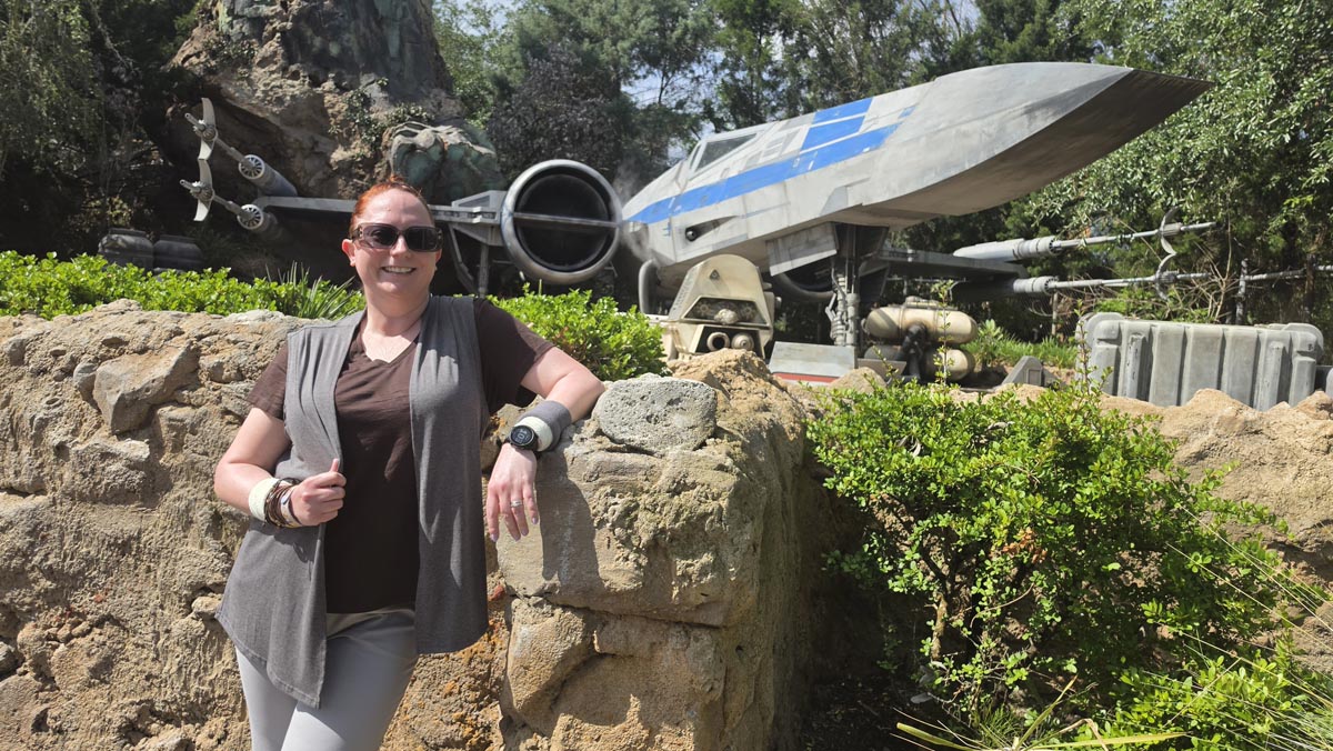 Kelly bounding as Rey at Star Wars: Galaxy’s Edge in Disney’s Hollywood Studios