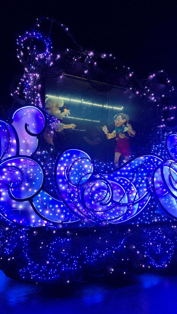 Pinocchio and Geppetto dancing on a float in the Disney Starlight parade