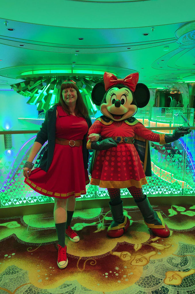 Kelly bounding as Superhero Minnie with Superhero Minnie on the Disney Destiny