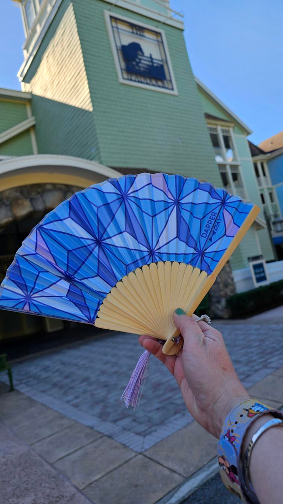 Dapper Day fan in front of Disney’s Saratoga Springs Resort & Spa building