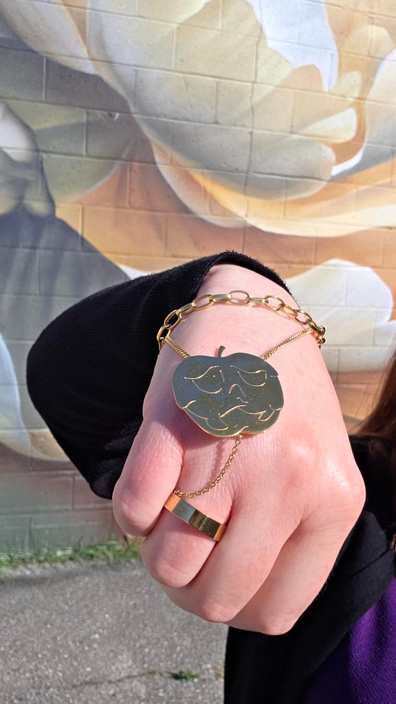 close-up shot of the Poison apple hand-bracelet