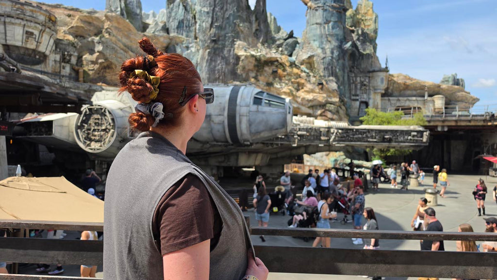 Kelly bounding as Rey looking towards the Millennium Falcon at Star Wars: Galaxy’s Edge in Disney’s Hollywood Studios