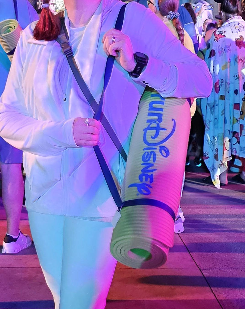 RunDisney Yoga mat rolled up and carried by Kelly at Disney’s Hollywood Studios