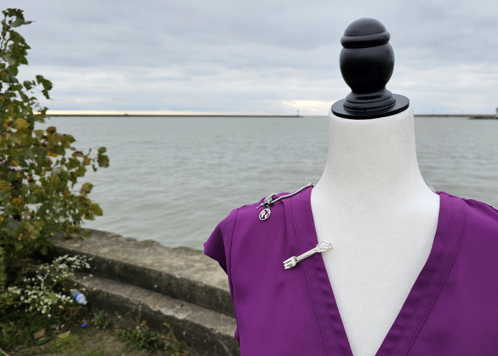 Detailed shot of accessories from the Mermaid Princess Bounding Box on mannequin with water in the background