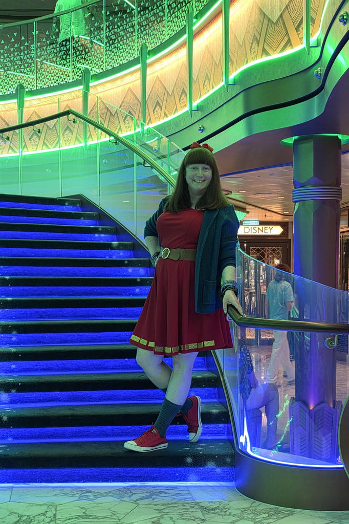 Kelly bounding as Superhero Minnie in the Grand Hall of the Disney Destiny