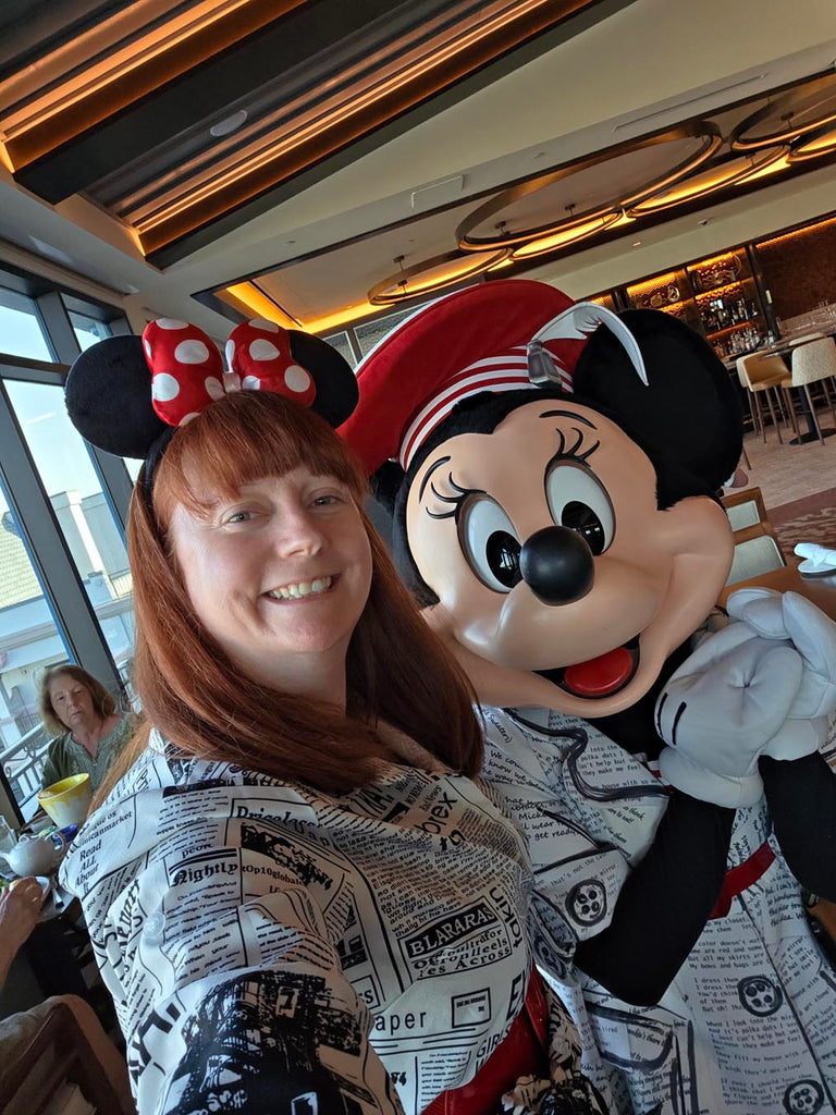 Kelly bounding as Poet Minnie with Poet Minnie at Topolino’s Terrace
