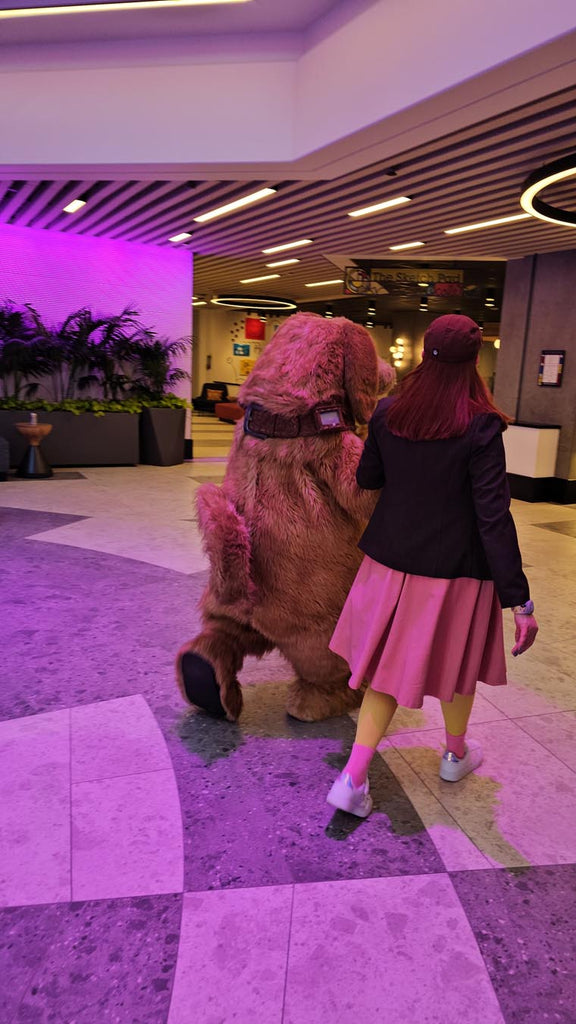 Kelly bounding as Bing Bong and Dug walking with each other