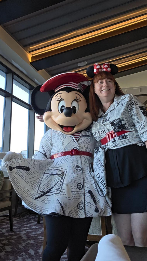 Kelly bounding as Poet Minnie with Poet Minnie at Topolino’s Terrace