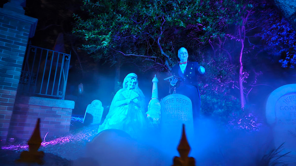 Ghosts Madame Carlotta and Butler Broome in the graveyard at the Haunted Mansion during MNSSHP