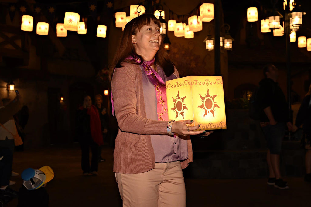 Kelly bounding as Rapunzel while meeting Rapunzel at Magic Kingdom