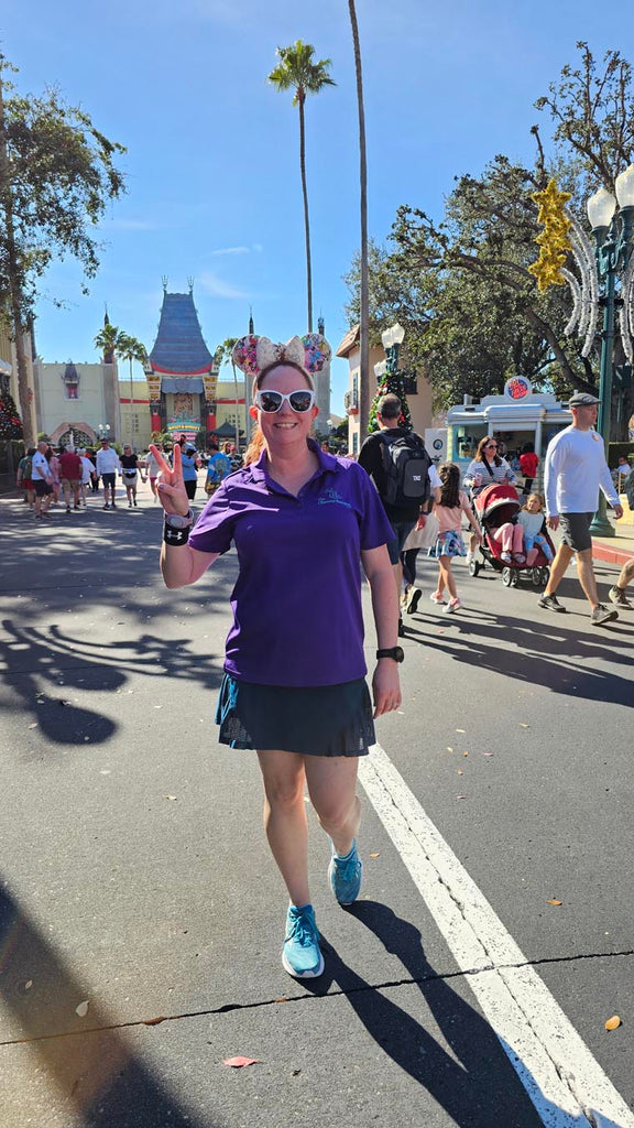 Kelly on Hollywood Blvd with two fingers up indicating park #2