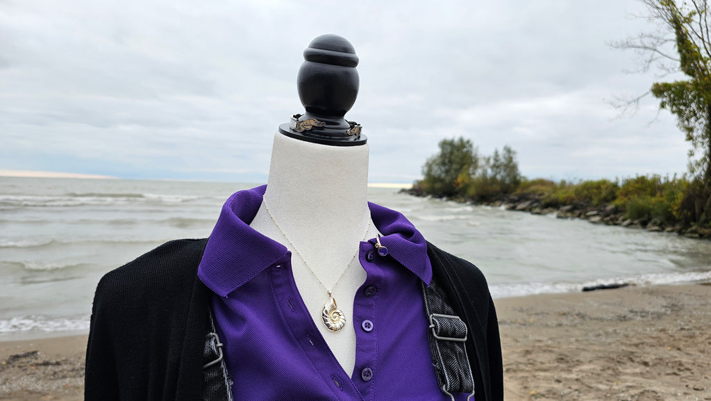 Detailed shots of the accessories from the Sea Witch bounding boxes on mannequin at a beach with sand and water in the background