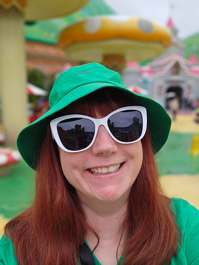 Kelly bounding as Luigi in Super Nintendo World