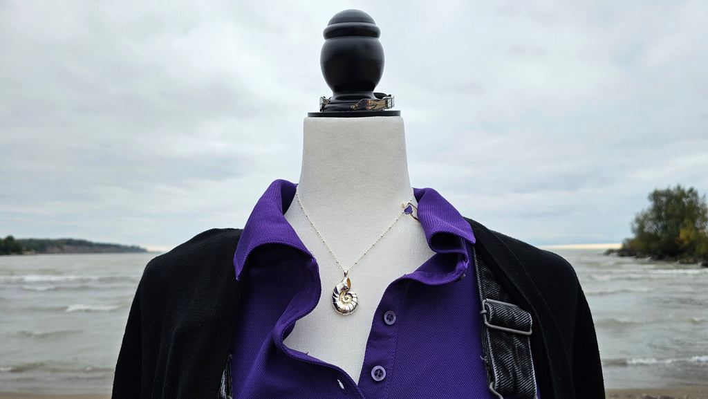 Detailed shots of the accessories from the Sea Witch bounding boxes on mannequin at a beach with sand and water in the background