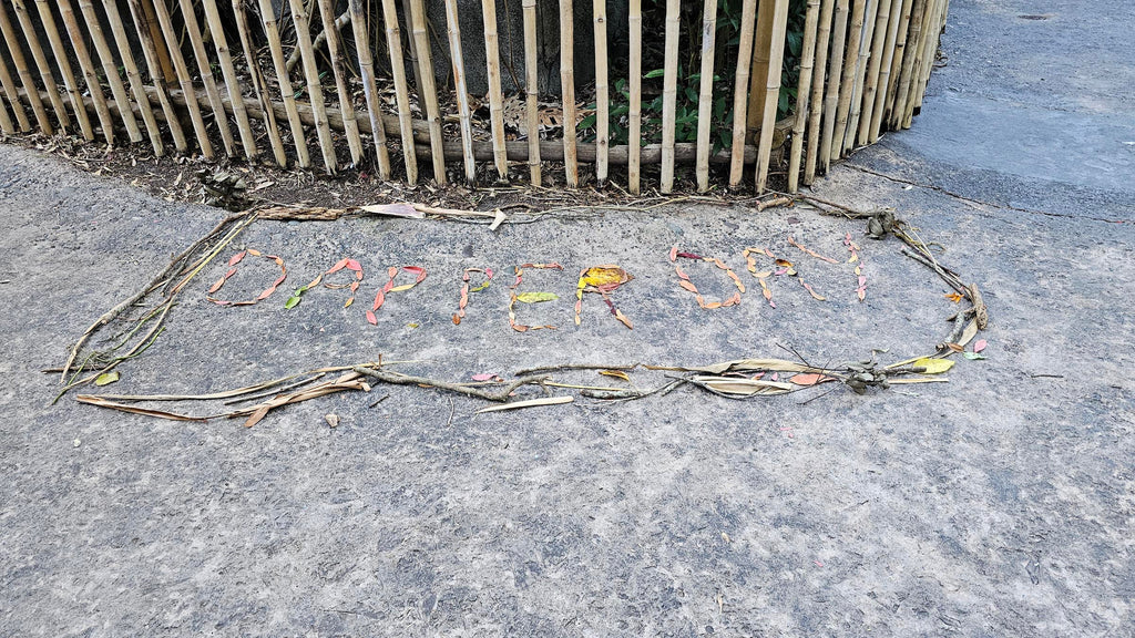 Dapper Day sign made out of leaves from Disney’s Animal Kingdom