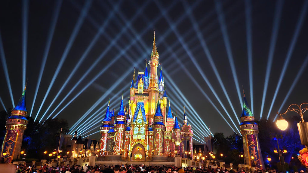 Cinderella Castle at Magic Kingdom with fireworks in the background