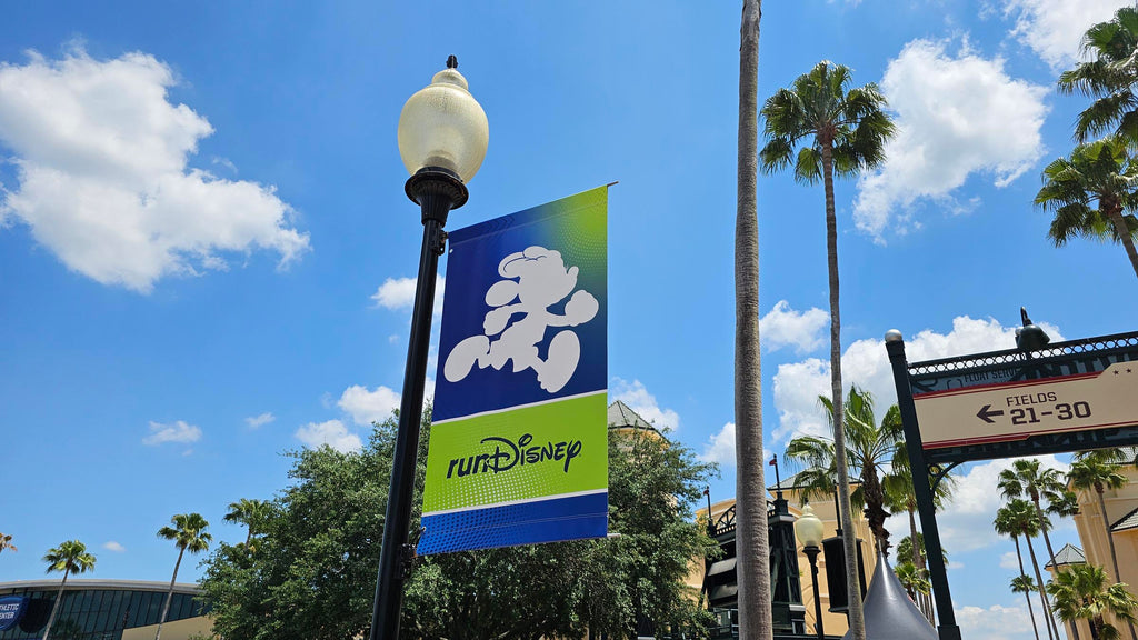 Run Disney Minnie sign with a blue sky in the background