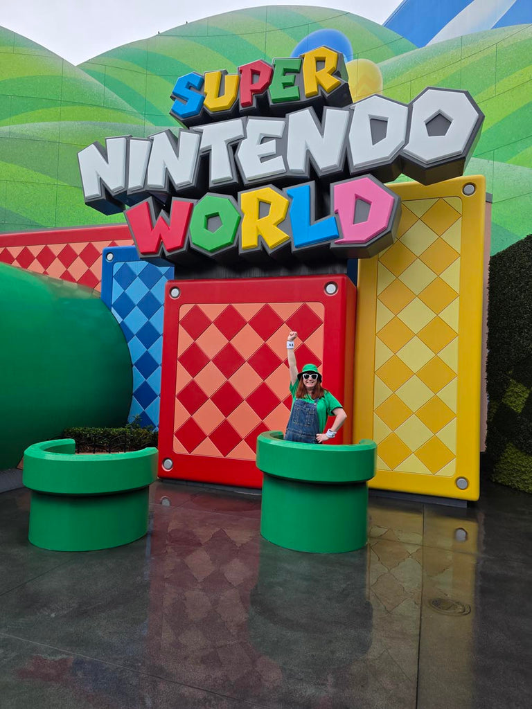 Kelly bounding as Luigi in Super Nintendo World