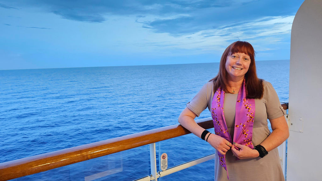 Kelly bounding as Rapunzel on a balcony on the Disney Magic