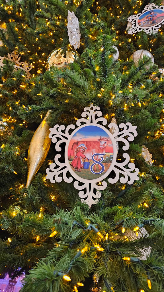 close of decoration on the Christmas tree in the lobby of Disney’s Grand Floridian picturing 8 maids a milking