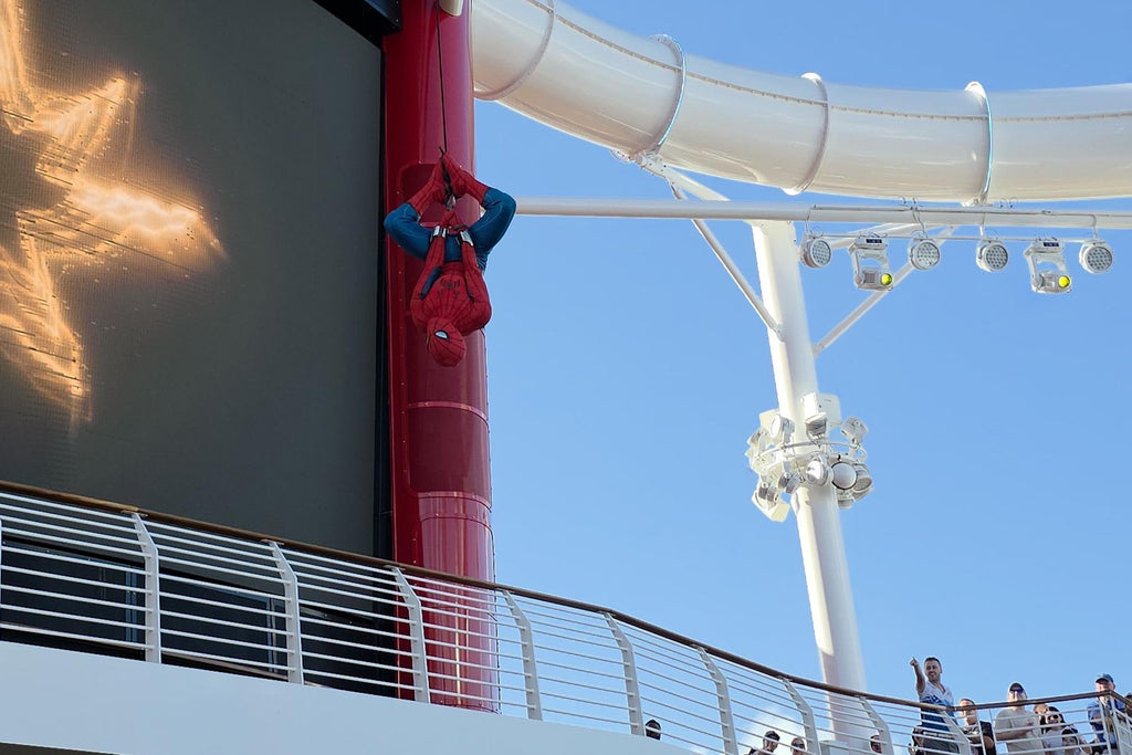 Spiderman rappelling on the Disney Destiny