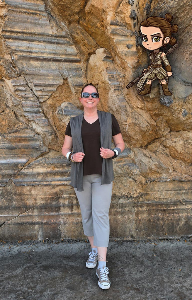 Kelly bounding as Rey with a Rey cartoon version at Star Wars: Galaxy’s Edge in Disney’s Hollywood Studios