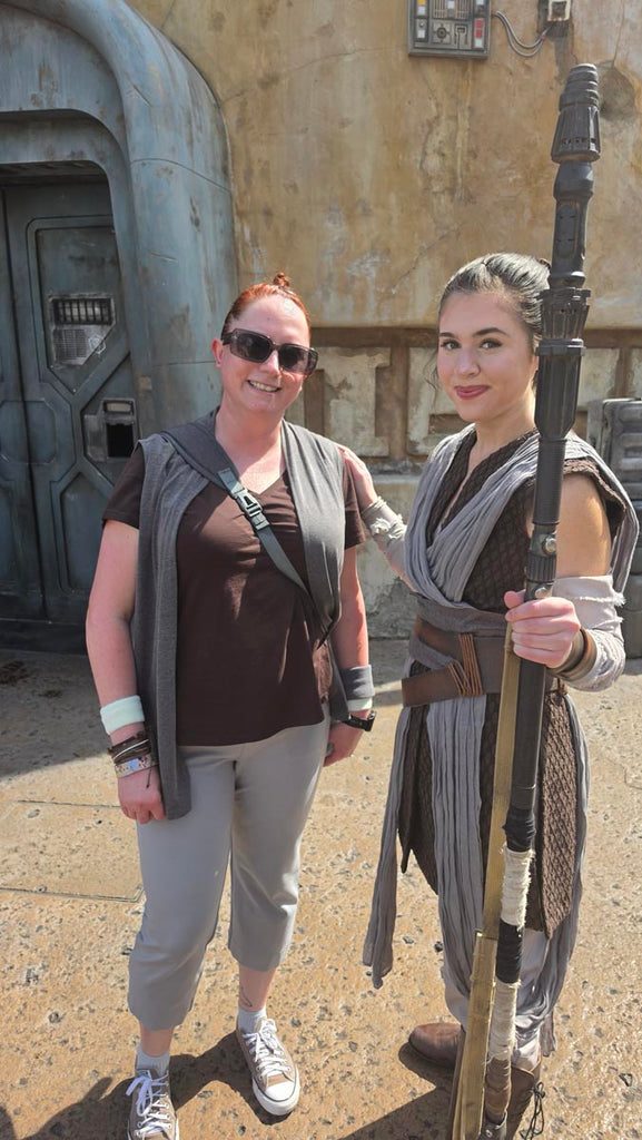 Kelly bounding as Rey while meeting Rey at Star Wars: Galaxy’s Edge in Disney’s Hollywood Studios