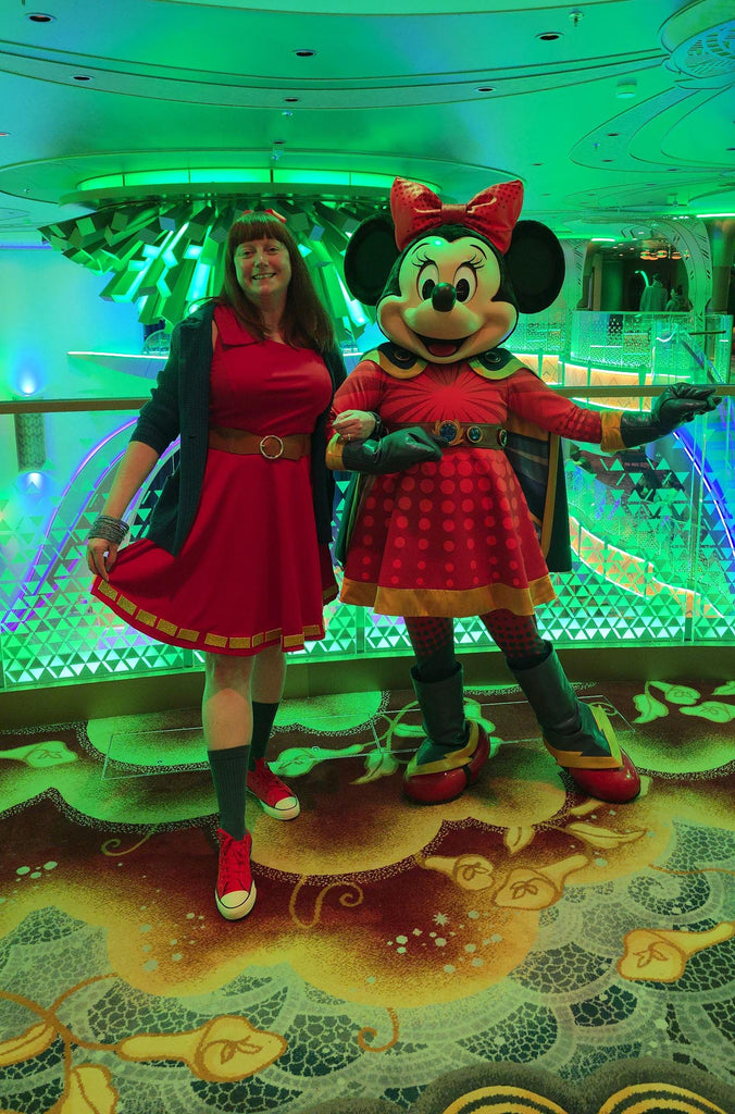 Kelly bounding as Superhero Minnie with Superhero Minnie on the Disney Destiny