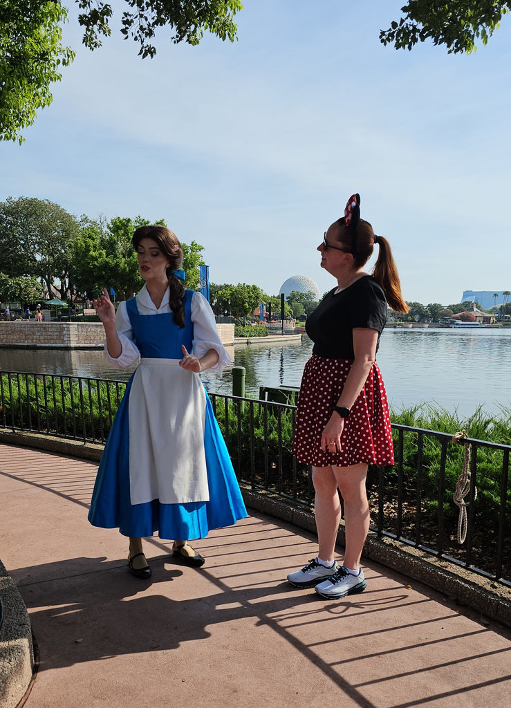 Kelly bounding as Minnie Mouse talking with Belle