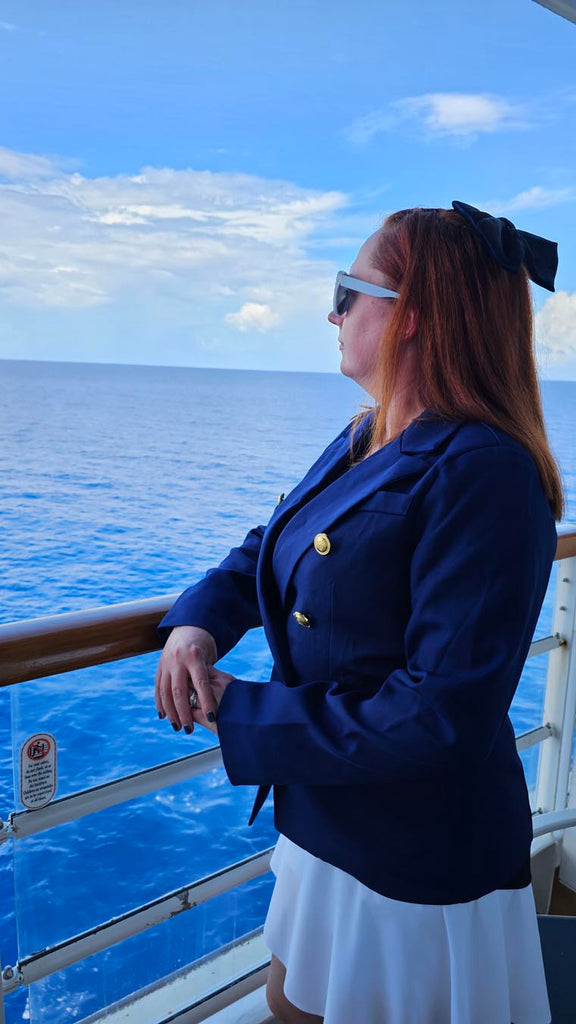 Kelly on a balcony of the Disney Magic and bounding as Captain Mickey