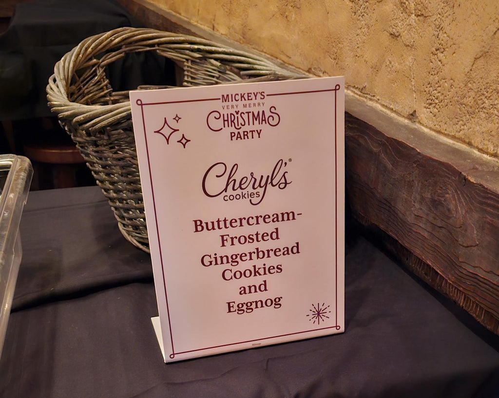 sign for a gingerbread cookie and eggnog as part of Mickey’s Very Merry Christmas Party