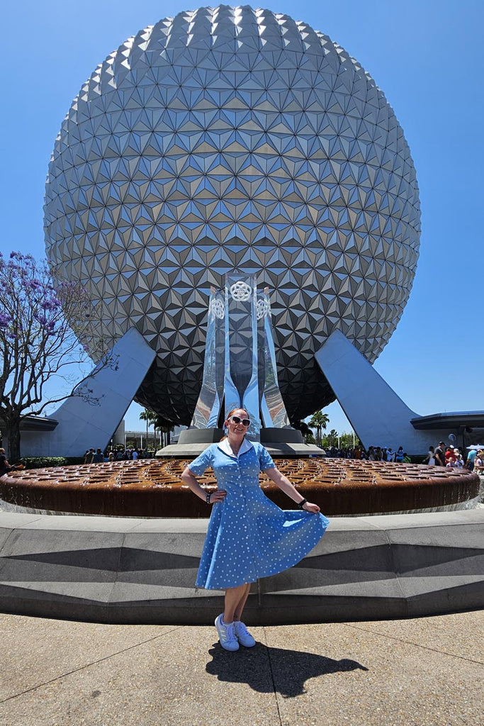 Kelly bounding as Dapper Belle at in front of the geosphere at Epcot