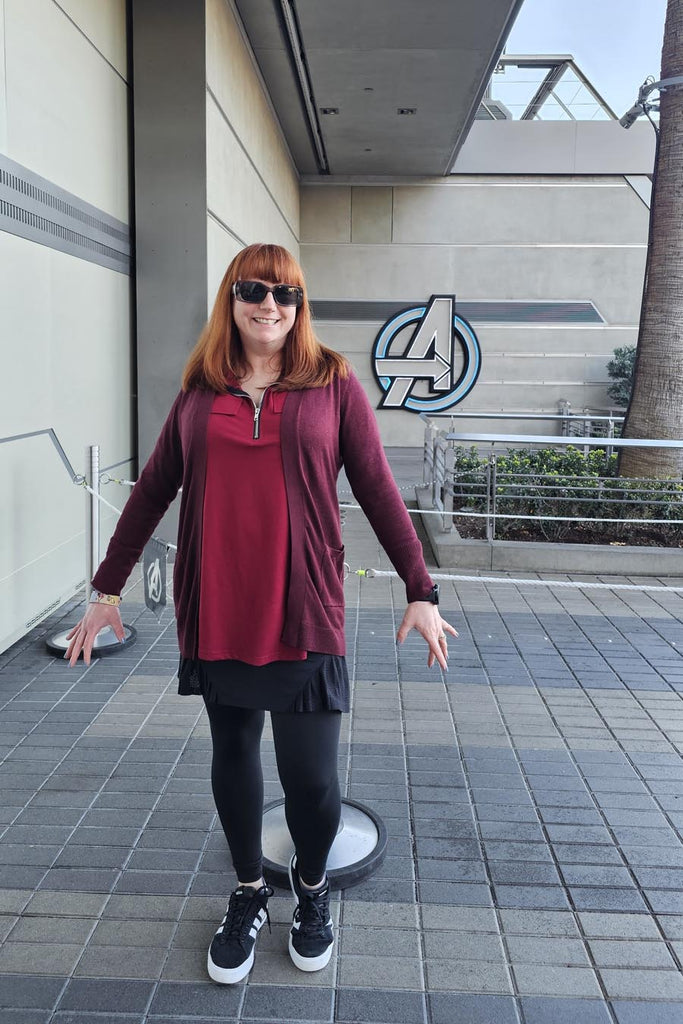Kelly bounding as Scarlet Witch at Avengers Campus