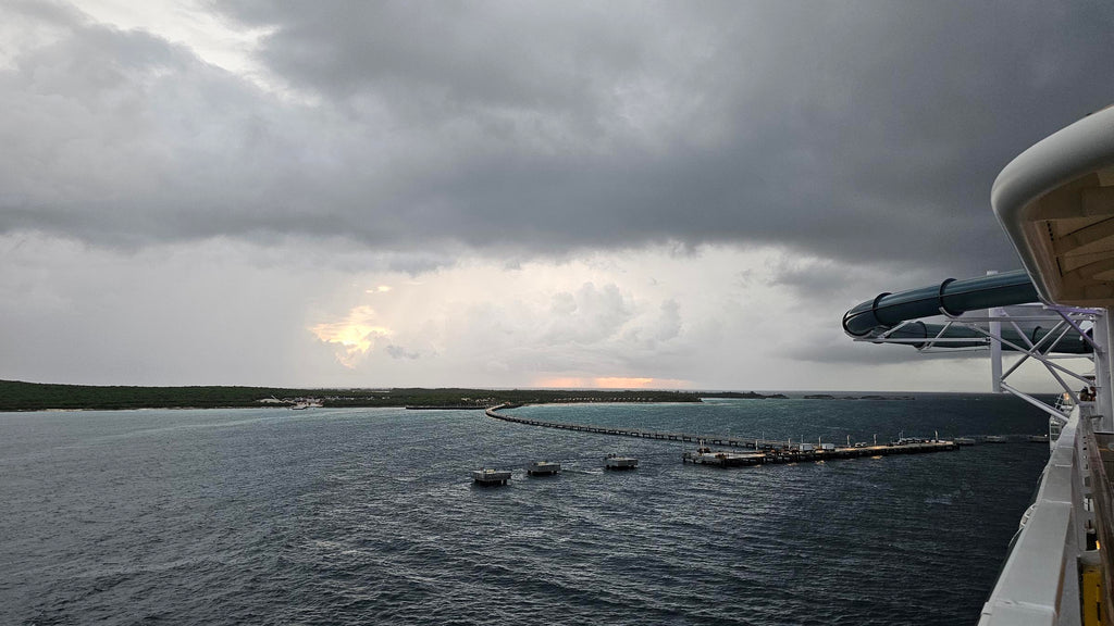 view of the dock and island of Lookout Cay at Lighthouse Point from being onboard a Disney ship