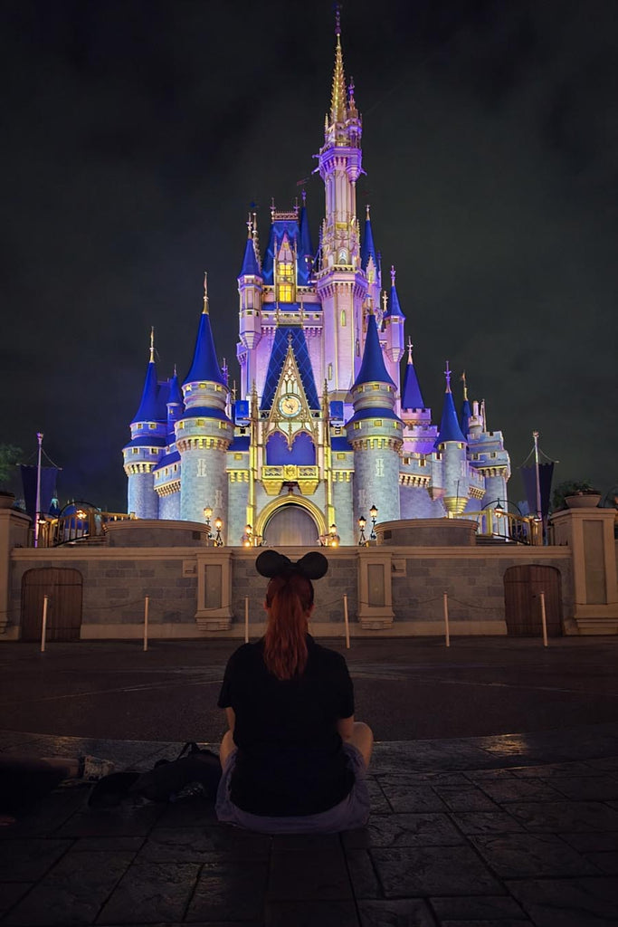 photo 5 – Kelly sitting in front of Cinderella Castle with no one else around her