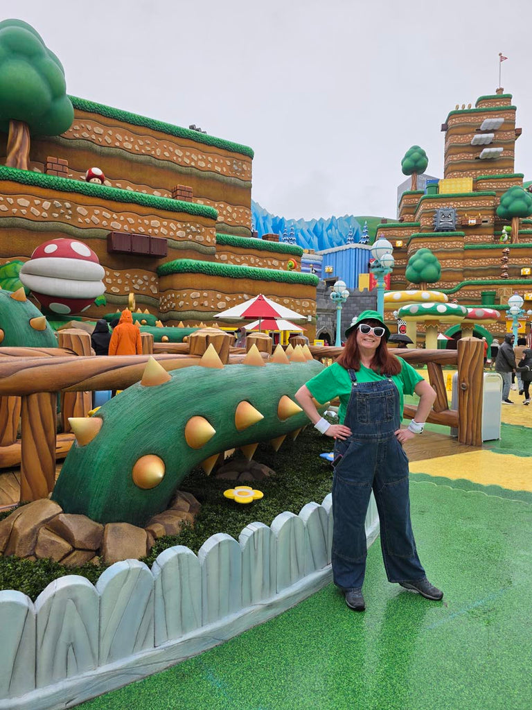 Kelly bounding as Luigi in Super Nintendo World at Universal Studios Hollywood