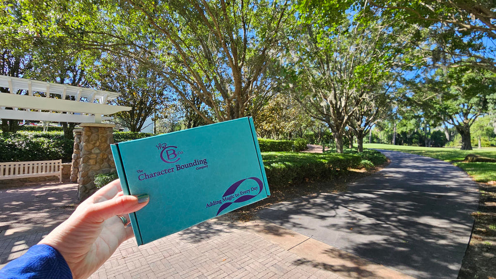 TheCB.Co box being held up trees and a walkway in the background