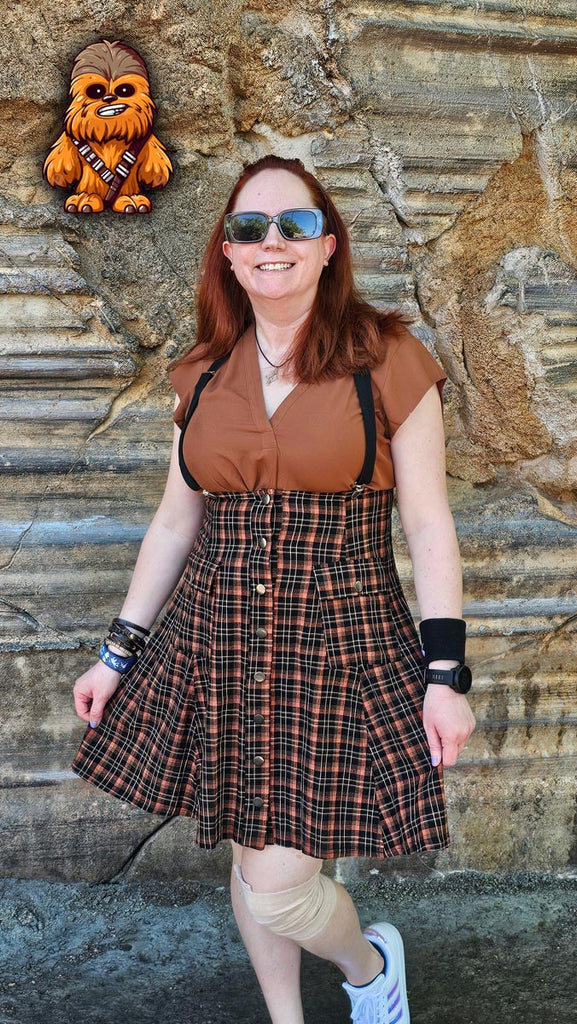 Kelly bounding as Chewbacca with a cartoon Chewbacca at Star Wars: Galaxy’s Edge in Disney’s Hollywood Studios