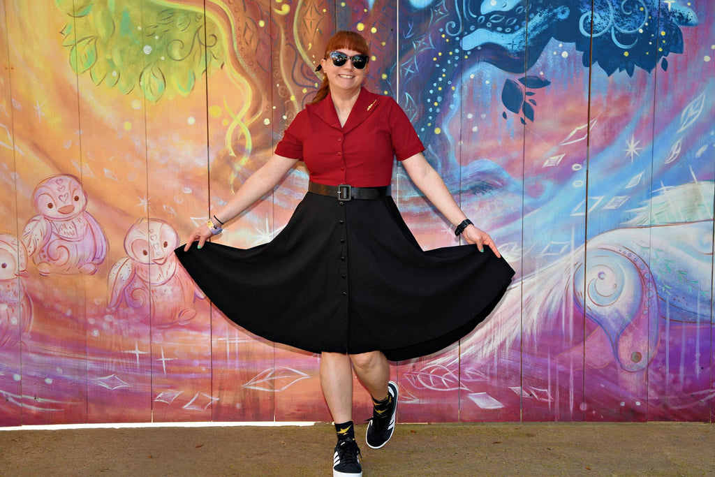 Kelly bounding as Jafar in front of mural at Disney’s Animal Kingdom