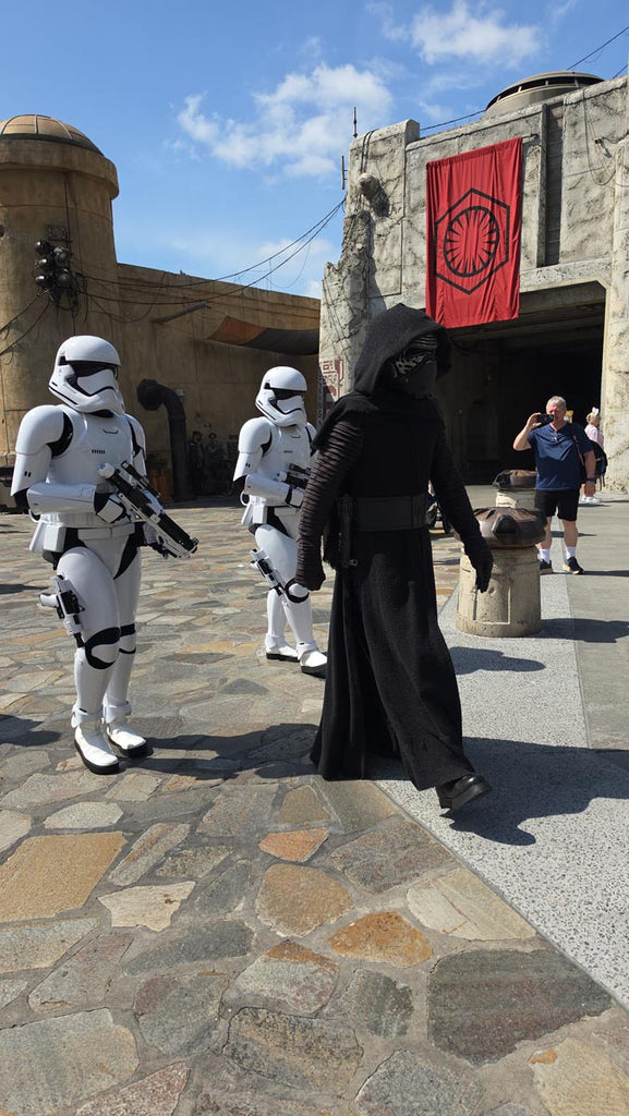 Stormtroopers and Kylo Ren marching through Star Wars: Galaxy’s Edge in Disney’s Hollywood Studios