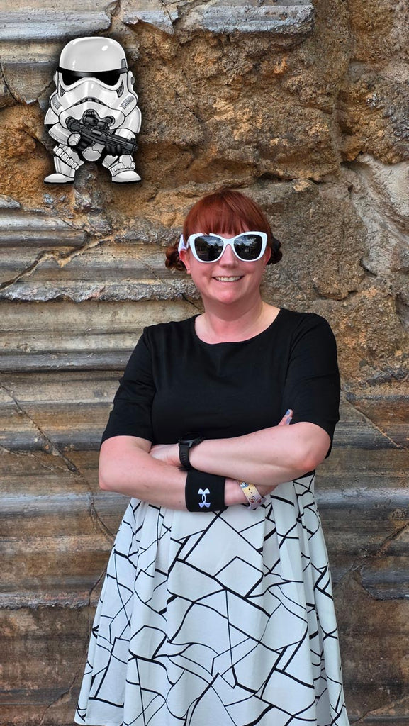 Kelly bounding as a Stormtrooper with a cartoon Stormtrooper at Star Wars: Galaxy’s Edge in Disney’s Hollywood Studios