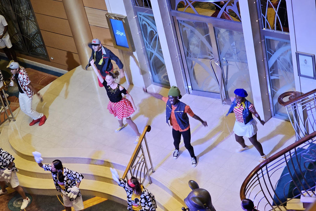 Disney Cruise Line performers form Mickey’s Sail-A-Wave Party bounding as Disney characters