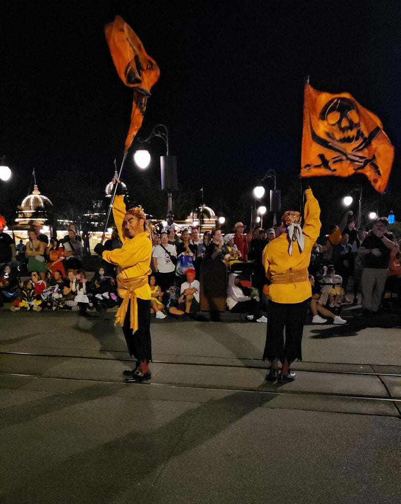 Pirate flag corps in the Boo-to-You Parade at Magic Kingdom