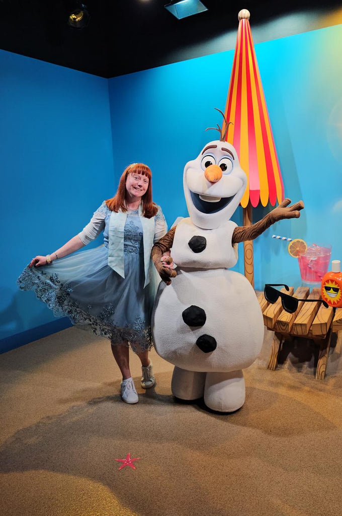 Kelly bounding as Dapper Ice Queen Elsa with Olaf at Disney’s Hollywood Studios