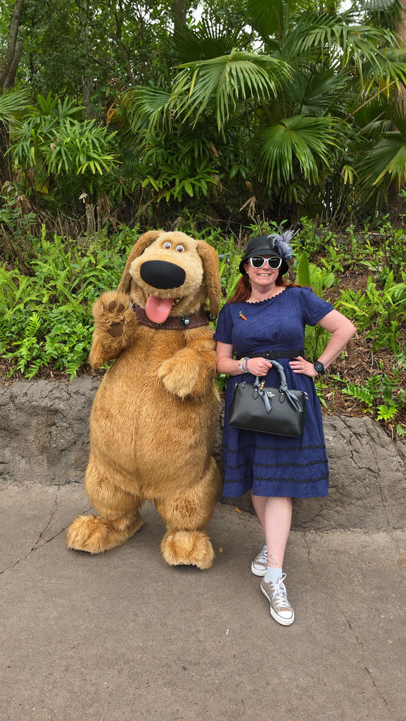 Kelly in her Dapper Judy Hopps bound with Dug from Up