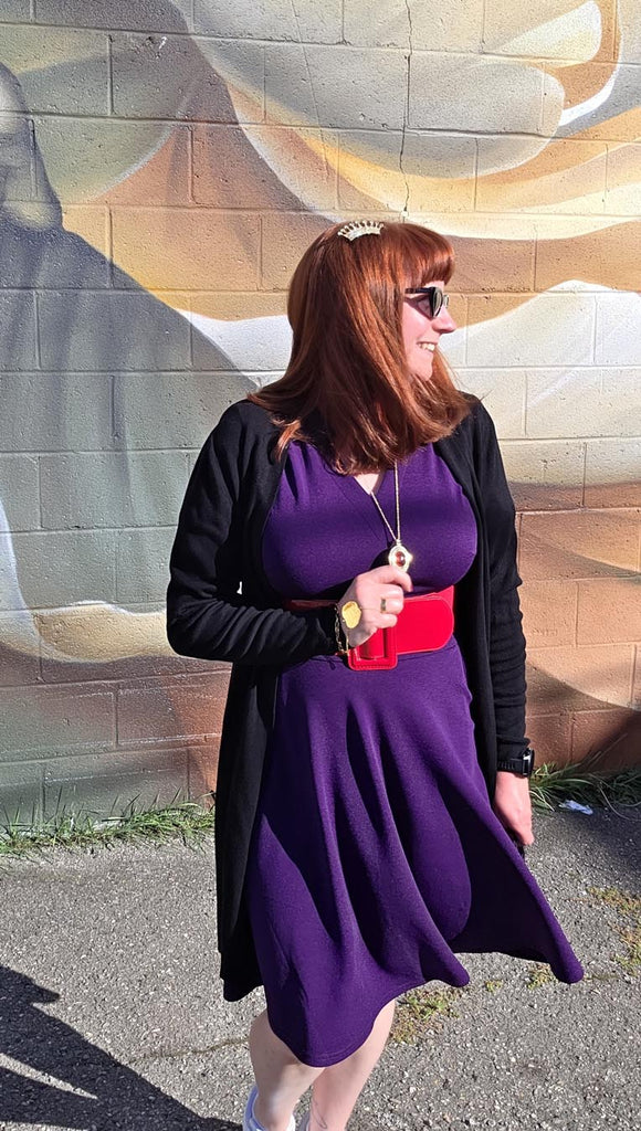 Kelly bounding as Evil Queen, looking away from the camera